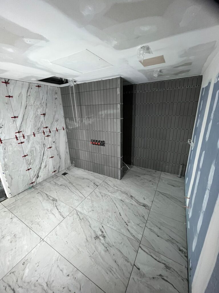 Commercial tilers Manchester completing tiling at the MCFC Presidential Suite by A1 Tiling Ltd